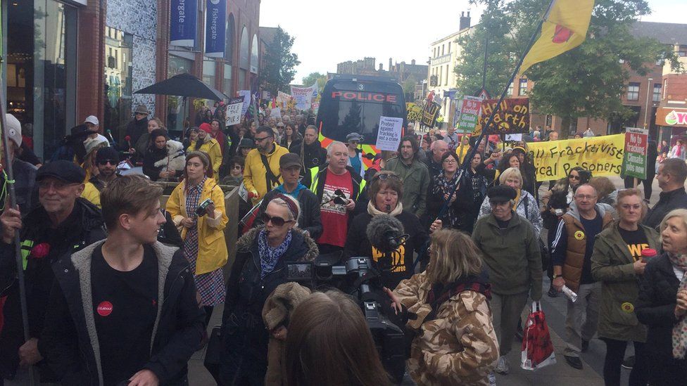 Protesters march in Preston in support of anti-fracking campaigners
