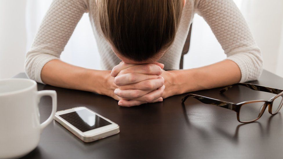 File image of woman at table