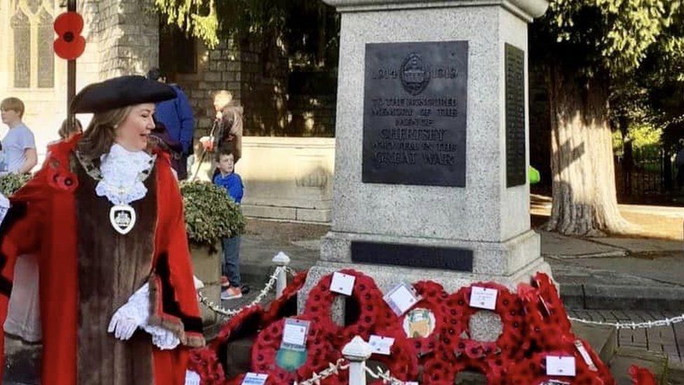 Wreaths are laid at a war memorial in Chertsey, Surrey
