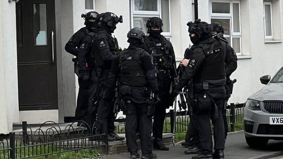 Armed police outside address in Gloucester