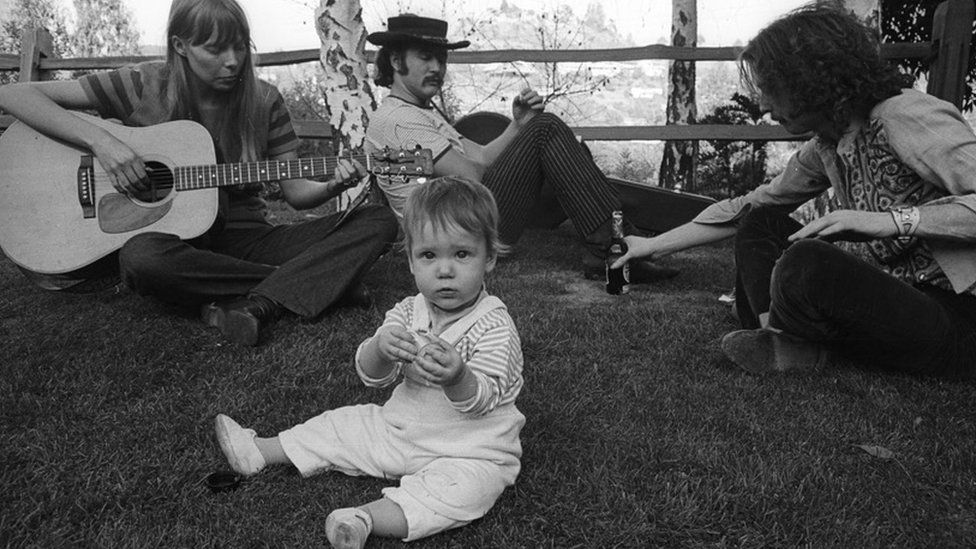 Owen Elliott-Kugel as a baby with Joni Mitchell, David Crosby and Eric Clapton.