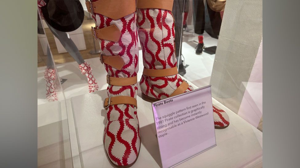 White mid-length Vivienne Westwood boots with red squiggle pattern and brown straps, Northampton Gallery