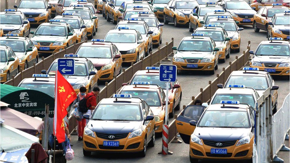 Taxis queue up in lines in front of Beijing railway station in Beijing, China, 15 July 2019