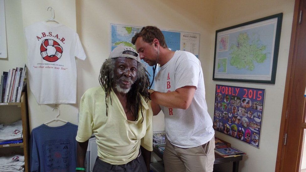 Patient Sinclair West is tended to by visiting British medical student, Ashley Davies.