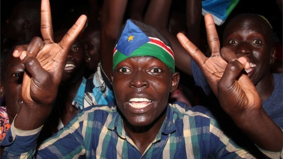 South Sudanese civilians celebrate the signing of a cease fire and power sharing agreement between President Salva Kiir and rebel leader Riek Machar, in Khartoum; along the streets of Juba, South Sudan August 5, 2018