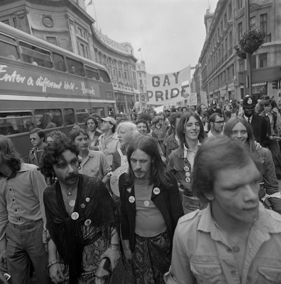 People attend the Pride march in 1977