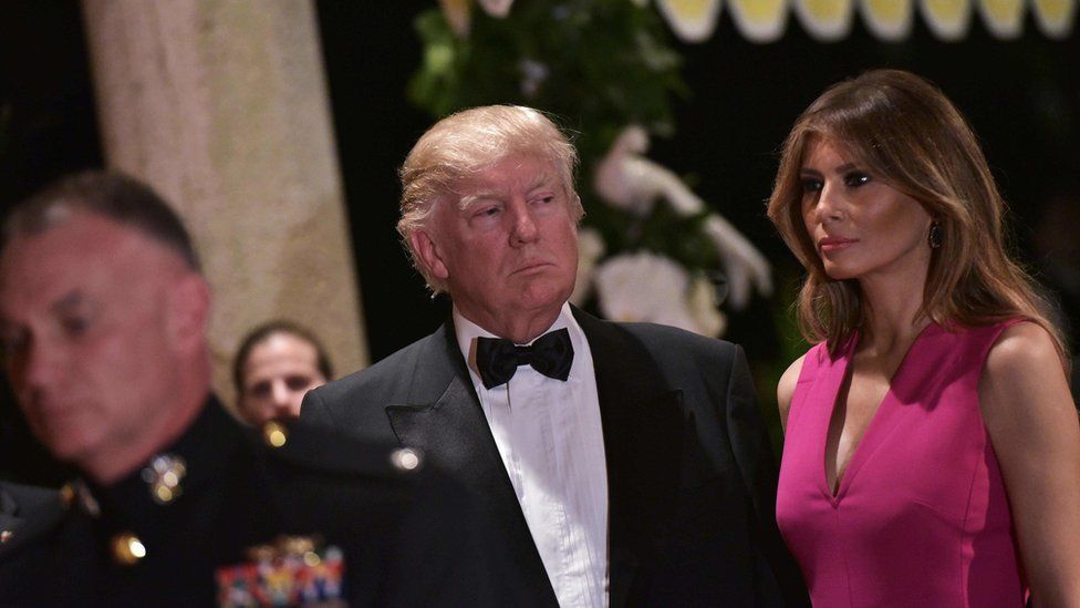 US President Donald Trump and First Lady Melania Trump arrive for the 60th Annual Red Cross Gala at his Mar-a-Lago estate in Palm Beach on February 4, 2017