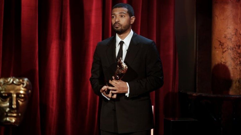 Noel collecting his Outstanding British Contribution to Cinema Bafta on 10 April