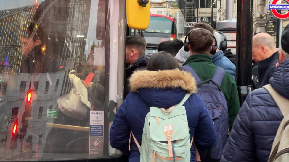 Commuters boarding a bus