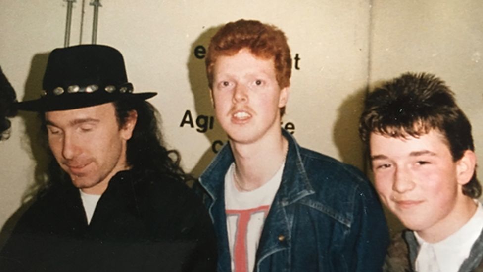 U2 fan Paul Duffy (centre) with a friend and The Edge in Belfast, March 1987