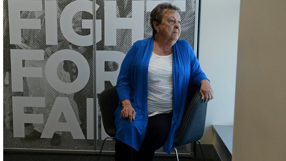 Cancer survivor Yvonne D'Arcy posing for photos at her lawyers' office in Brisbane, Australia