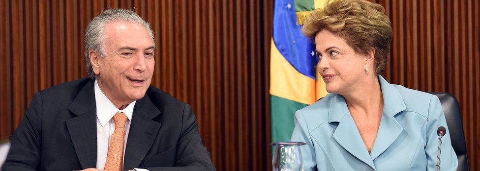 Brazilian President Dilma Rousseff (R) gestures next her Vice President Michel Temer in 2015