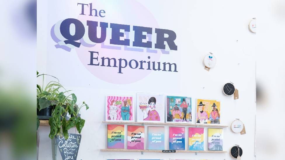 Posters and merchandise for sale at The Queer Emporium