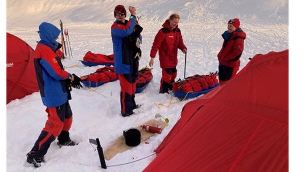 Isla Fosbury [right] with her friends setting up camp with the Polar Academy in Greenland