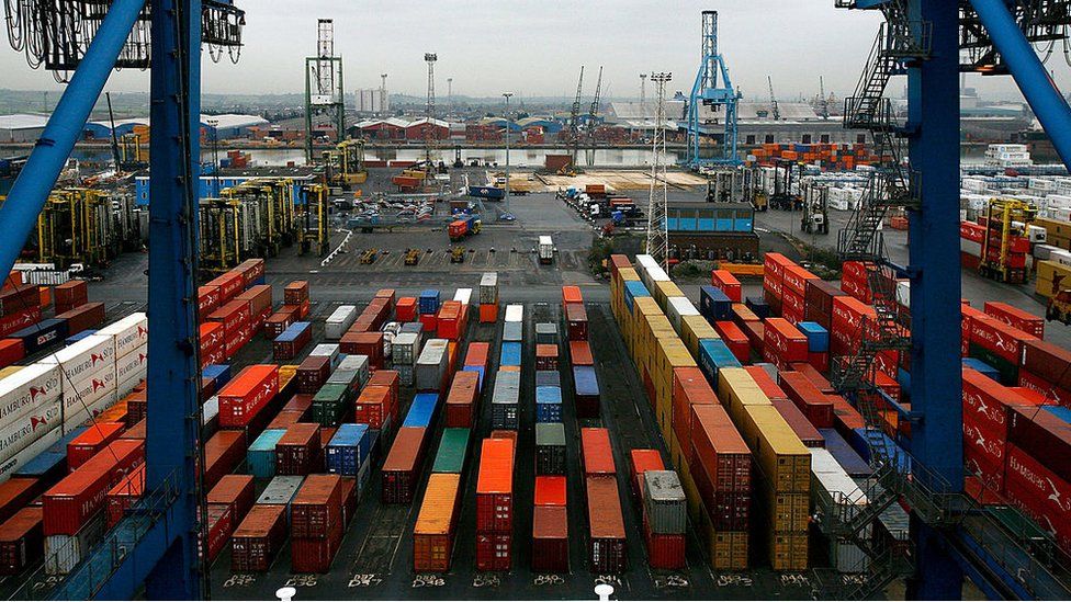 Shipping containers waiting to be loaded at Tilbury Docks in Essex