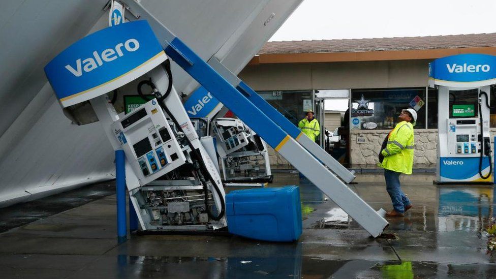 A canopy fallen over at a petrol station