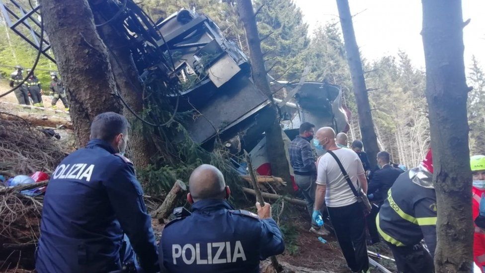 Police and other rescuers photographed at the scene of the wreckage