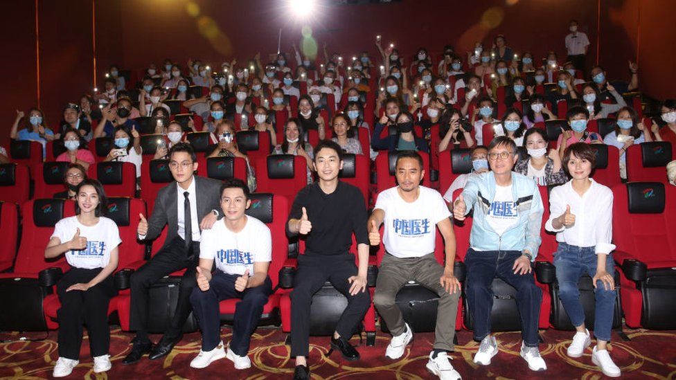 Actors attend the premiere screening of "Chinese Doctors", an anti-epidemic film, as a tribute to the centenary of the founding of the Communist Party of China, in Shanghai.
