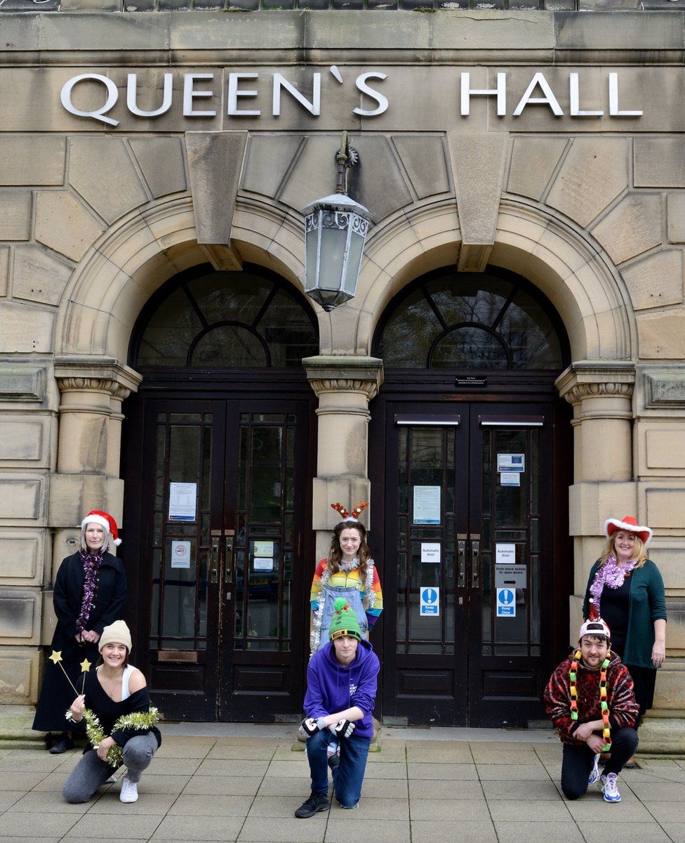 The cast of the Queen's Hall Christmas show outside the building
