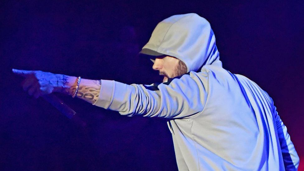 Eminem criticised after 'gunshot' sound effects cause panic at festival - BBC News Eminem criticised after 'gunshot' sound effects cause panic at festival - BBC News