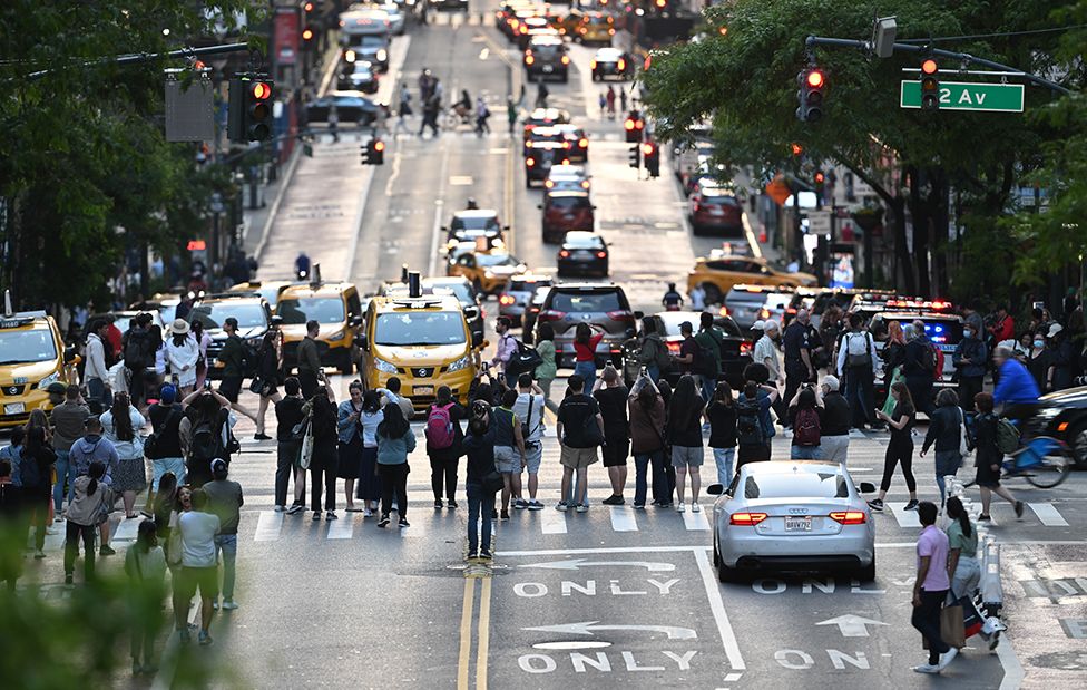 Thousands of New Yorkers and tourists flooded the streets of Manhattan to capture the sunset during the 'Manhattanhenge' in New York, United States on May 29, 2023