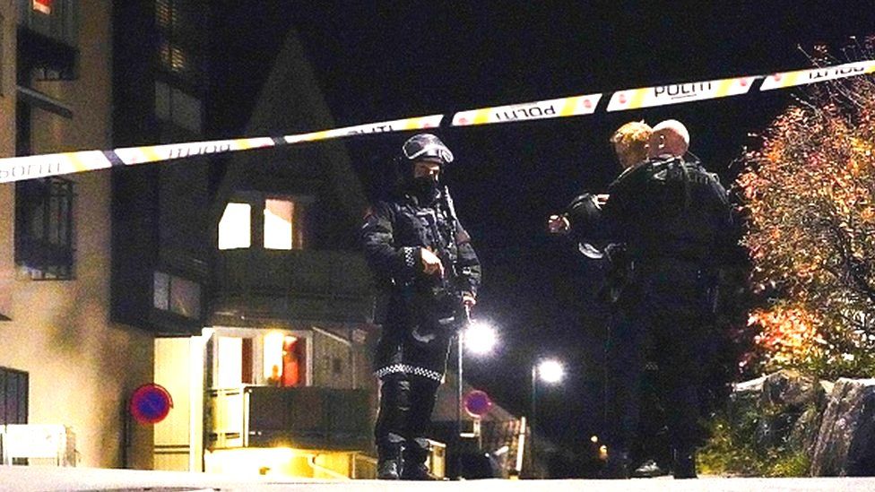 Police officers cordon off the scene where they are investigating in Kongsberg