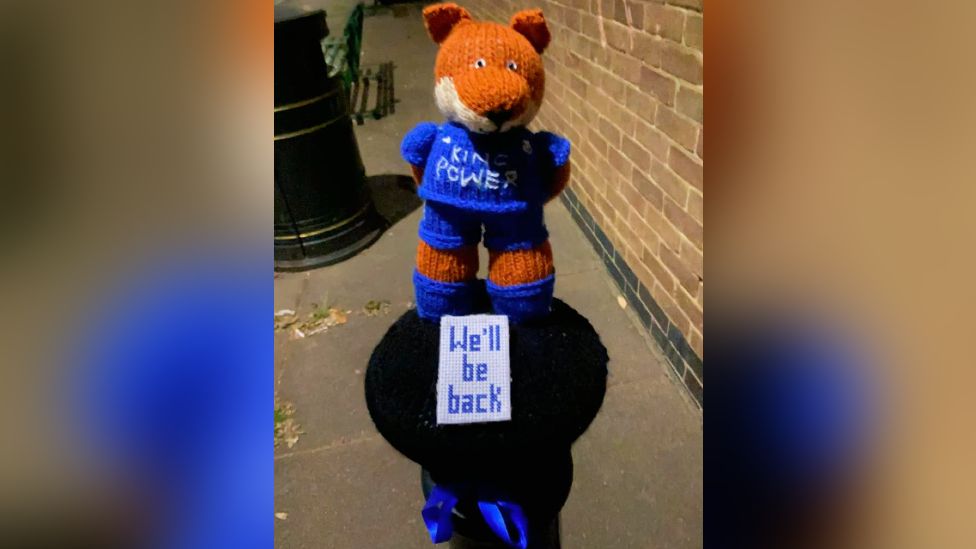 Bollard topper featuring Filbert Fox with the words "We'll be back"