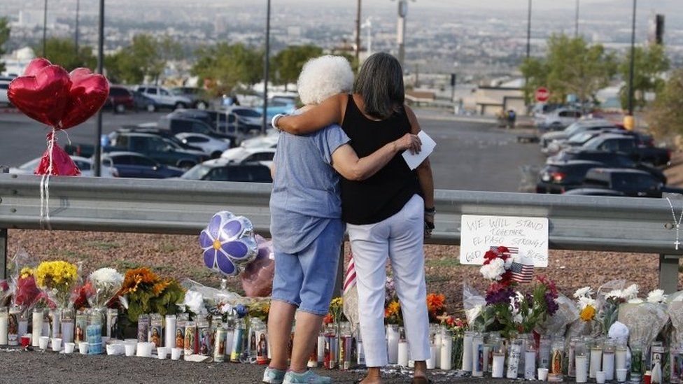 Mourners in El Paso Texas after a shooting there which killed 22 people