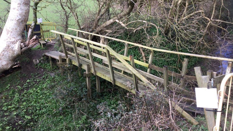 The old wooden bridge which has fallen into disrepair