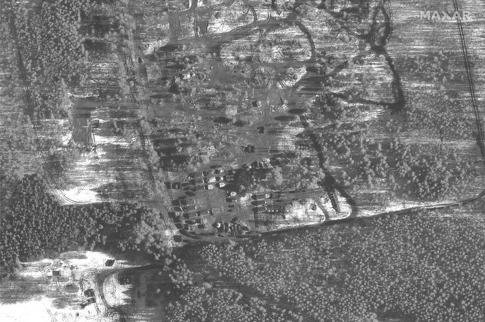 A handout satellite image made available by Maxar Technologies shows troop tents and housing area in Pochep, Russia