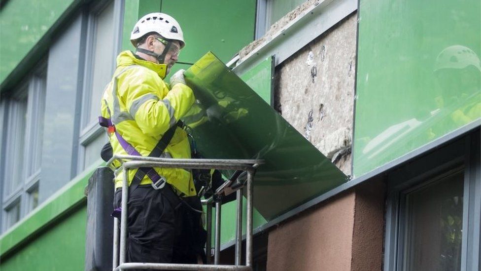 Cladding being removed from a block in Sheffield