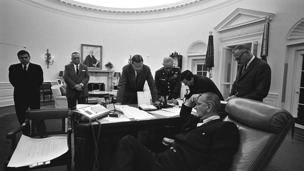 President Lyndon B. Johnson (seated), (background L-R): Marvin Watson, J. Edgar Hoover, Robert McNamara, Gen. Harold Johnson, Joe Califano at the Oval Office in 1967