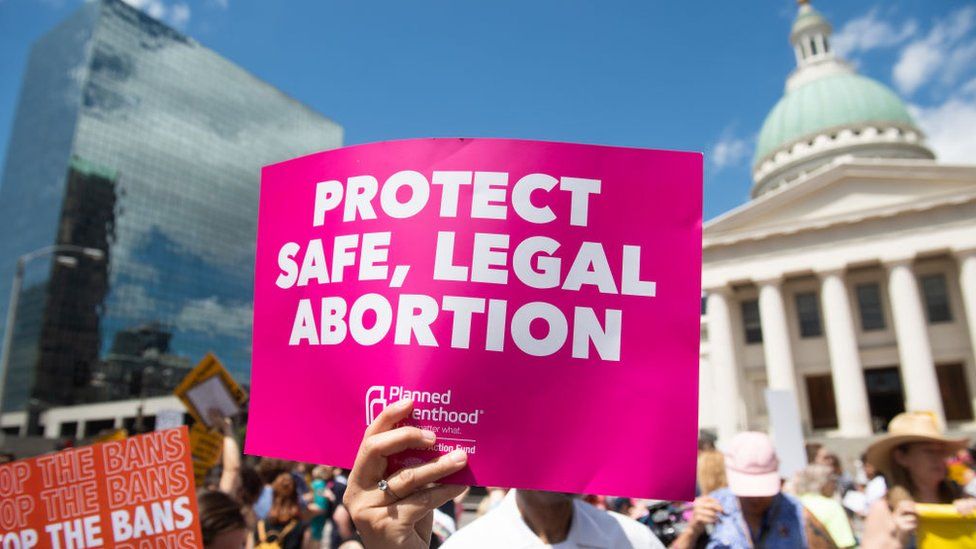 Protesters hold signs as they rally in support of Planned Parenthood and pro-choice and to protest a state decision that would effectively halt abortions by revoking the center's license to perform the procedure, near the Old Courthouse in St. Louis, Missouri, May 30, 2019