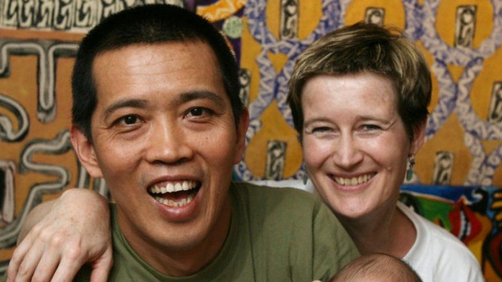 Portrait of Burmese artist Htein Lin with his wife Vicky Bowman and their baby Aurora. Karen Weber Gallery, Central. 21 MARCH 2008