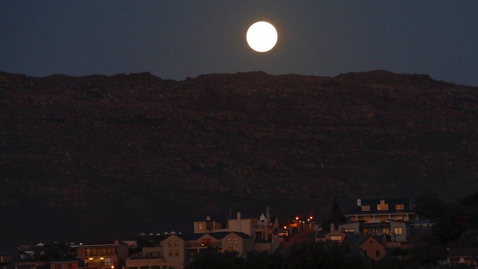 A supermoon rises over Table Mountain in Cape Town, South Africa - Sunday 3 December 2017