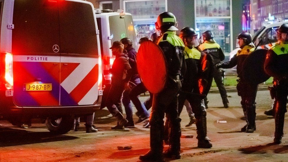 Police on the Beijerlandselaan during clashes with a group of young people in Rotterdam, The Netherlands