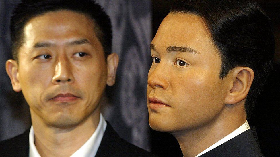 Daffy Tong, partner of Entertainer Leslie Cheung, looks at his waxwork unveiled at Madame Tussaud waxworks in Hong Kong, 31 March 2004. Leslie, Cheung one of Hong Kong's most acclaimed entertainers, leapt to his death 01 April 2003