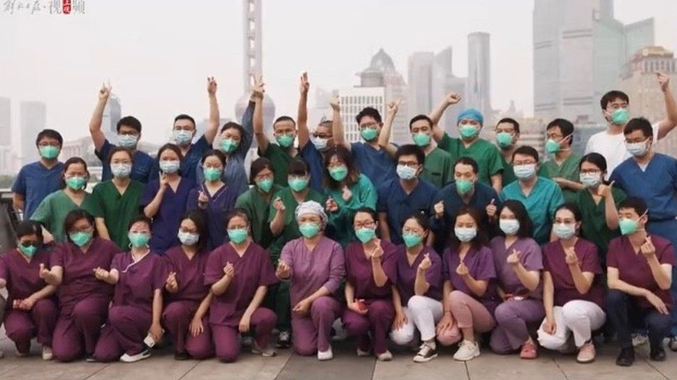 Photos of medical workers visiting city landmarks together
