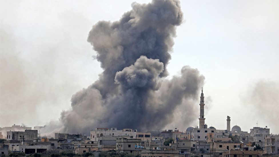 Smoke rises from the Syrian village of al-Nayrab in Idlib province on 3 February 2020
