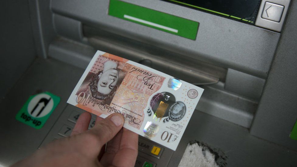 Cash being withdrawn from ATM