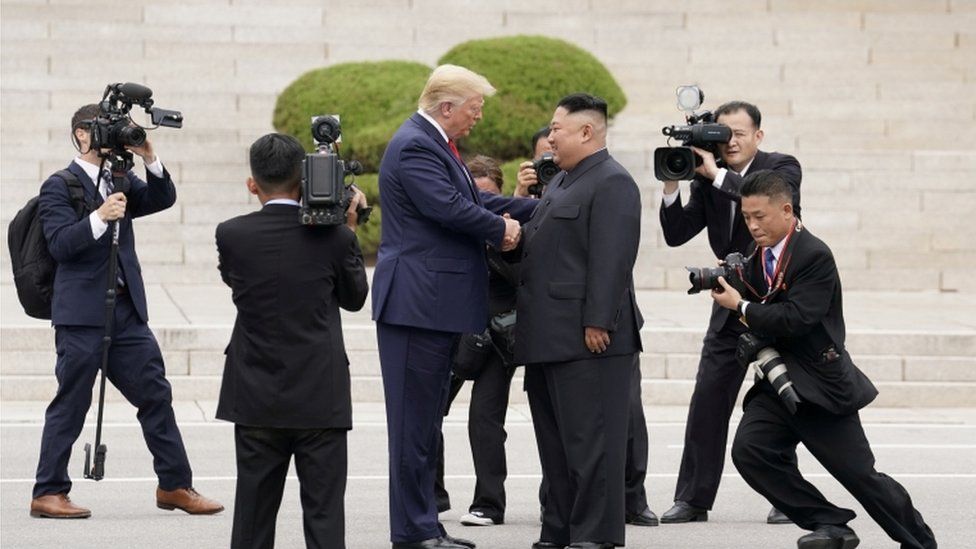 Donald Trump and Kim Jong-un shake hands at the DMZ (June 2019)