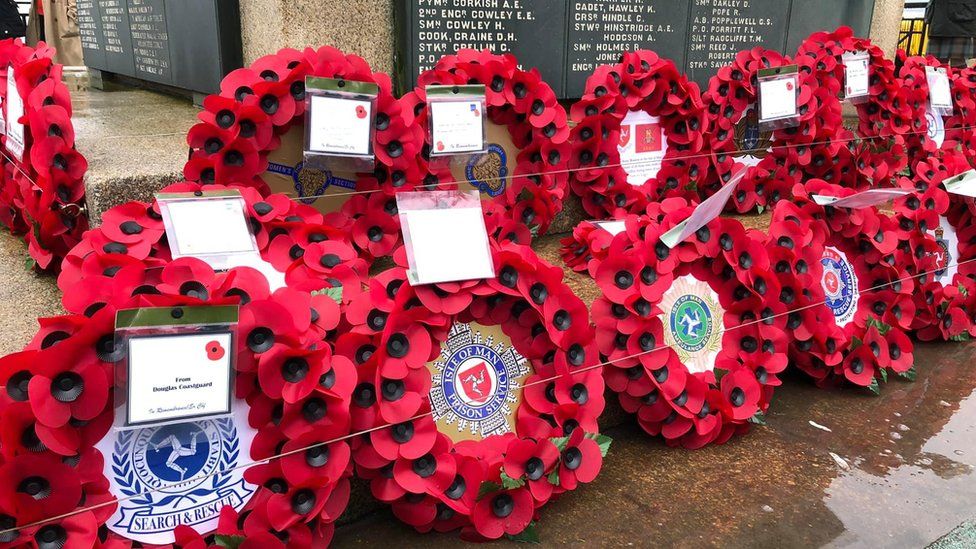 Wreaths at the foot of Douglas war memorial