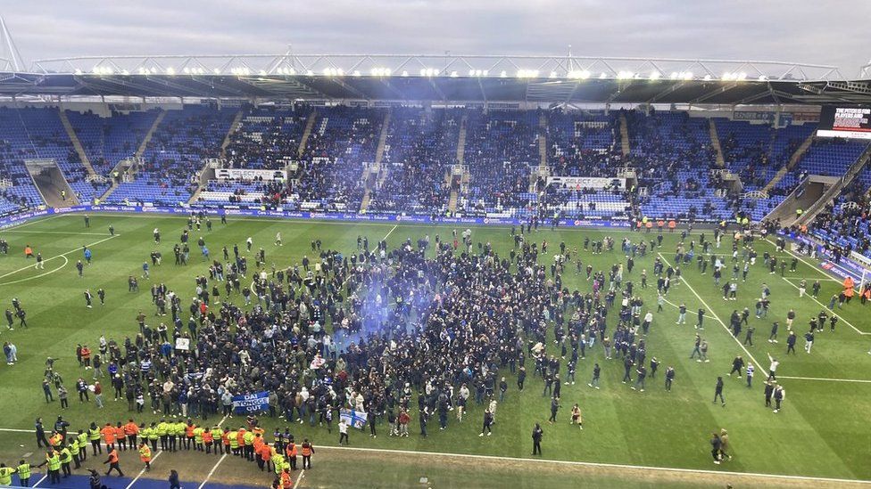 Reading fans invade the pitch