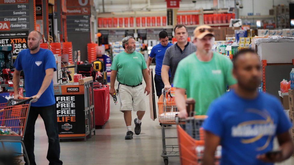 Customers shop at a Home Depot store on July 26, 2017 in Chicago, Illinois.