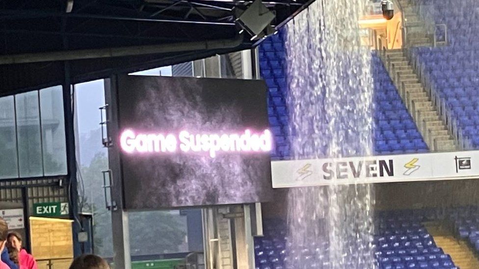 A sign saying a football game has been suspended due to rain at Portman Road.