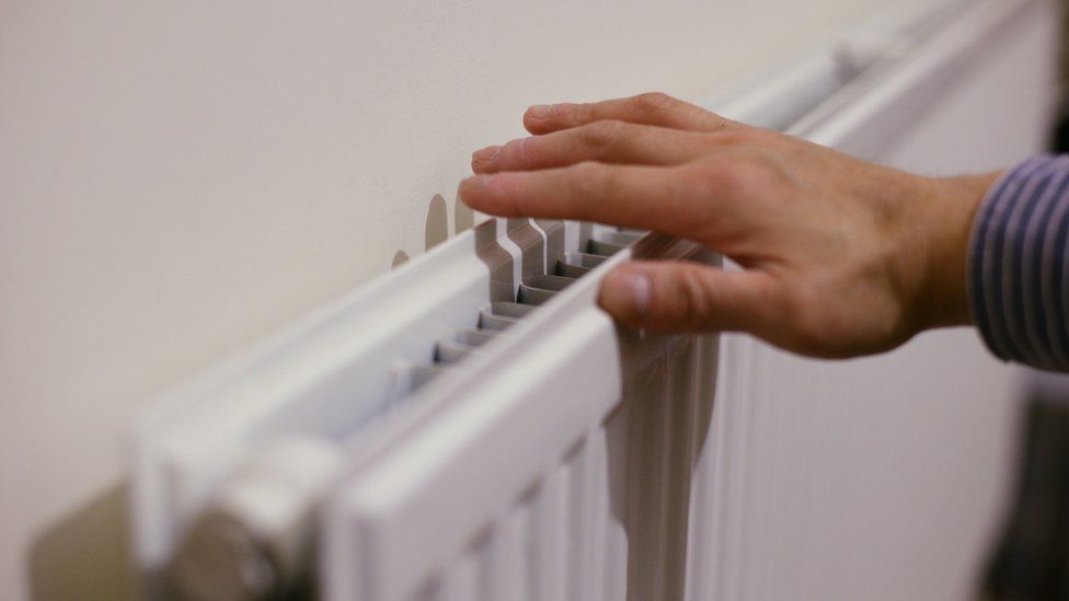A hand on a radiator
