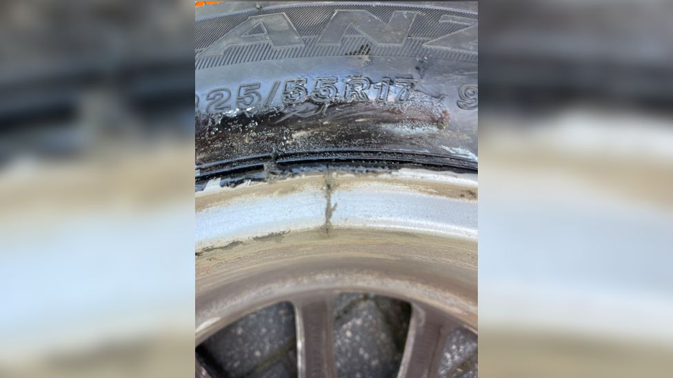 A picture of a damaged car tyre
