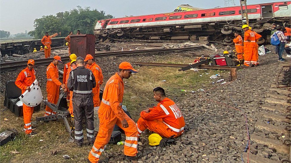 Rescue workers inspect wreckage at the accident site of a three-train collision near Balasore, about 200 km (125 miles) from the state capital Bhubaneswar, on June 3, 2023.