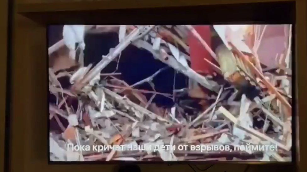 Image of war destruction on TV