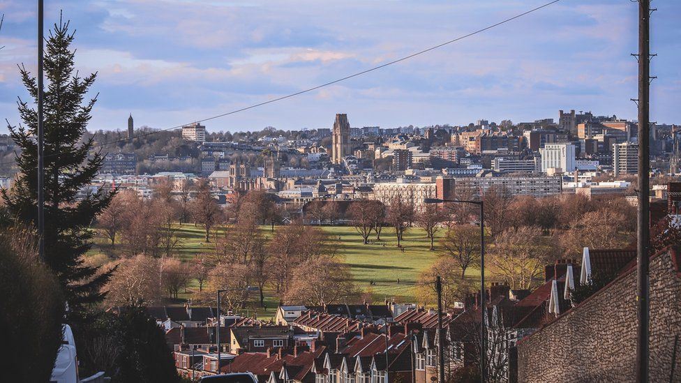 A view of Bristol showing Victoria Park in the foreground and the city centre in the background